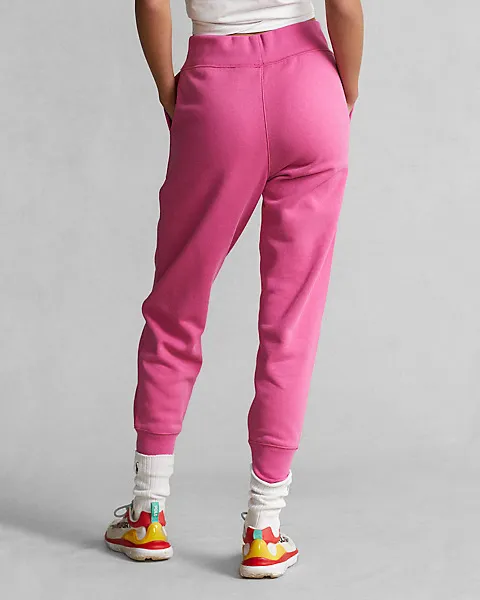 Jogger fucsia in felpa di misto cotone stretch con logo verde acido ricamato sul fianco